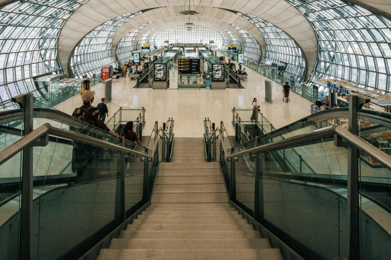 a group of people riding down an escalator, inspired by Thomas Struth, pexels contest winner, happening, thailand, terminal text, avatar image, airplane view