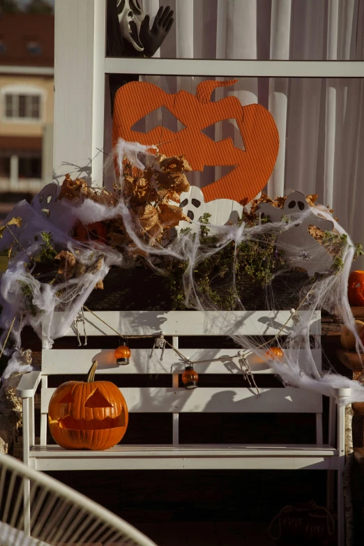 a porch decorated for halloween with decorations and pumpkins, by Ellen Gallagher, unsplash, vanitas, zoomed out view, podium, circa 1 9 8 4, an outdoor festival stage