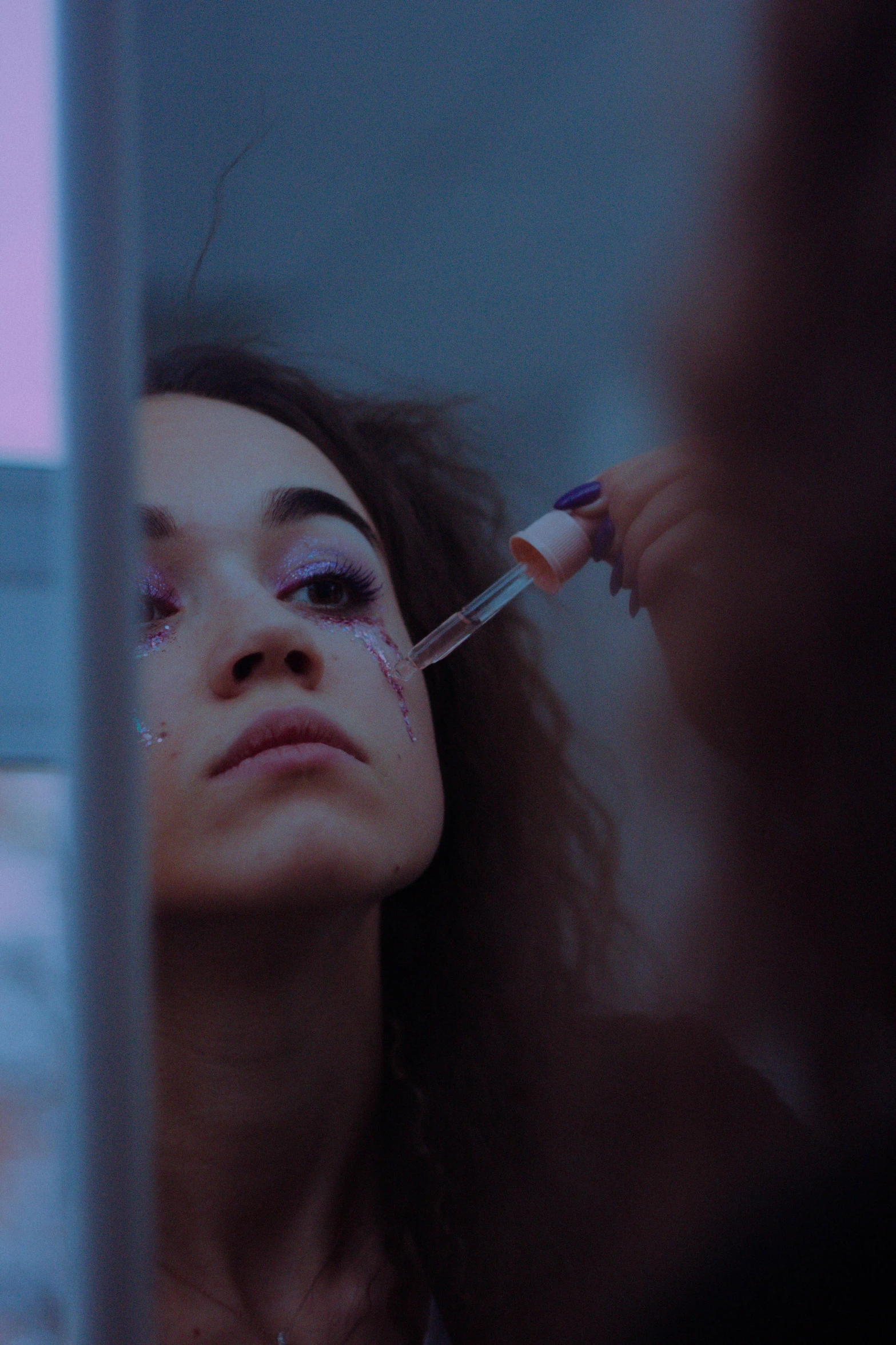 a woman getting her makeup done in front of a mirror, an album cover, trending on pexels, antipodeans, mixed race, with an iv drip, still from movie, [ theatrical ]