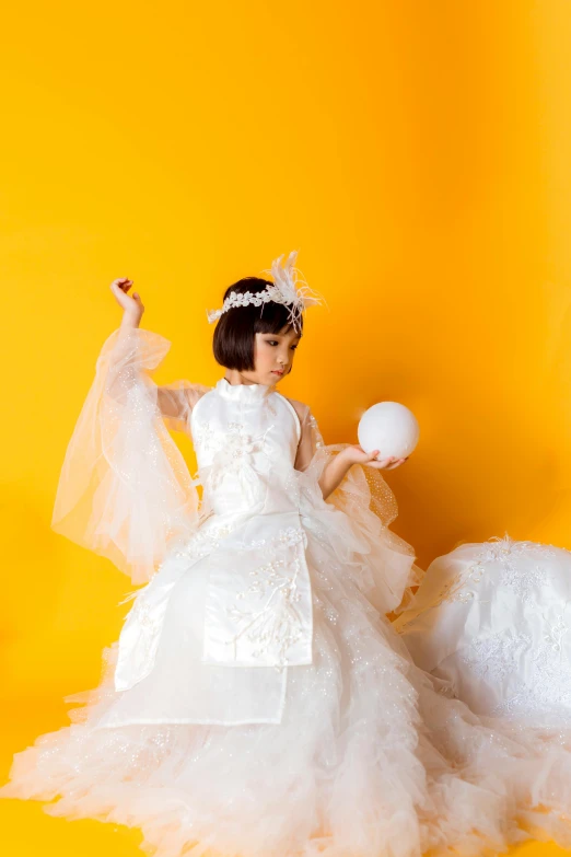 a little girl in a wedding dress on a yellow background, inspired by Fujiwara Takanobu, pexels contest winner, dry ice, kiko mizuhara, with a white background, glamourous cosplay