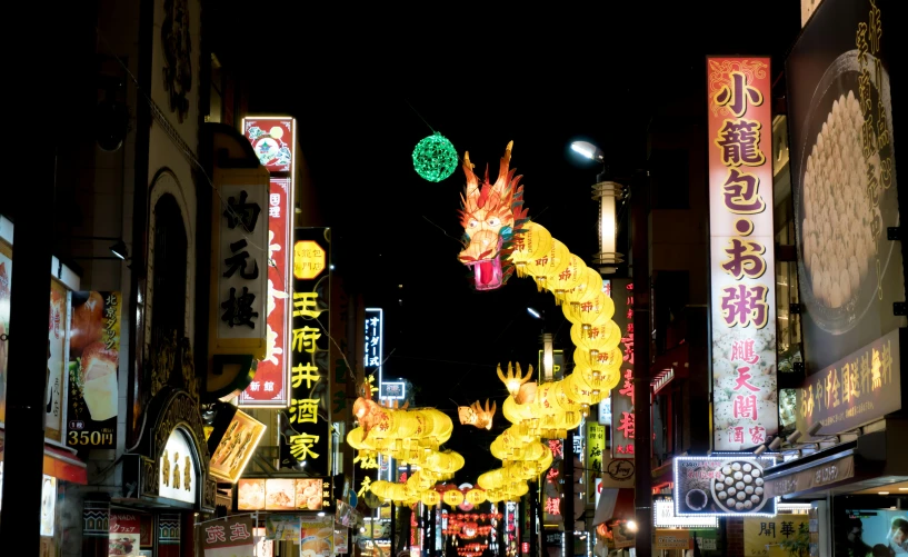 a group of people walking down a street at night, chinese dragon, yellow street lights, bright signage, decorations