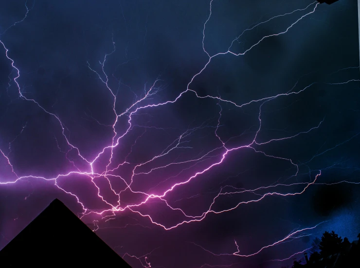 a sky filled with lots of lightning next to a building, inspired by Storm Thorgerson, pexels contest winner, purple and pink and blue neons, an extreme closeup shot, today\'s featured photograph 4k, electric wallpaper