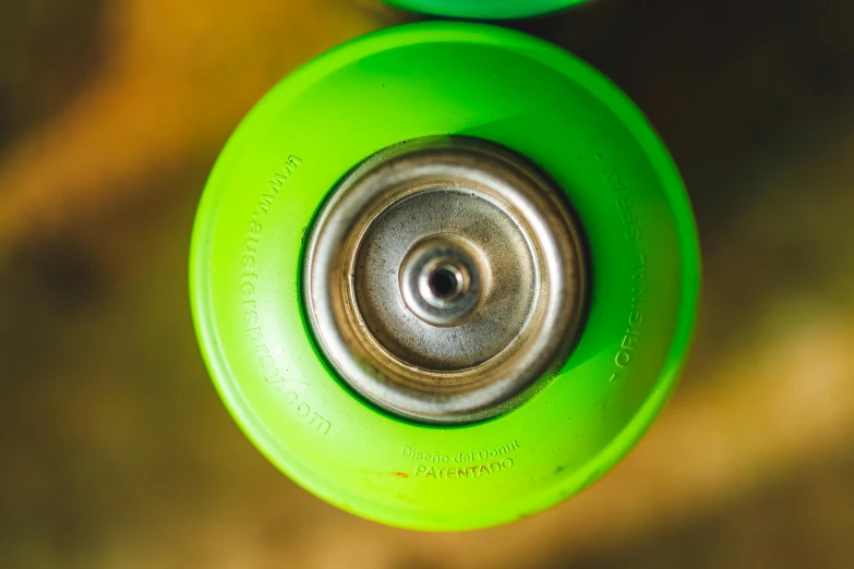 a close up of the top of a green skateboard, by Thomas Häfner, unsplash, graffiti, clutch yo - yo, sharing an oxygen tank, flickr explore 5 0 mm, lime green