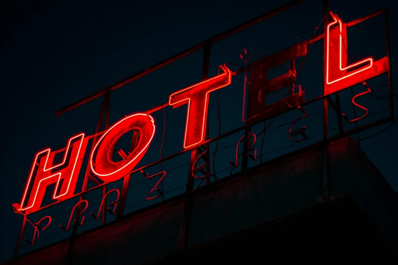 a neon hotel sign lit up at night, by Kristian Zahrtmann, pexels contest winner, red writing, avatar image, morning time, thumbnail