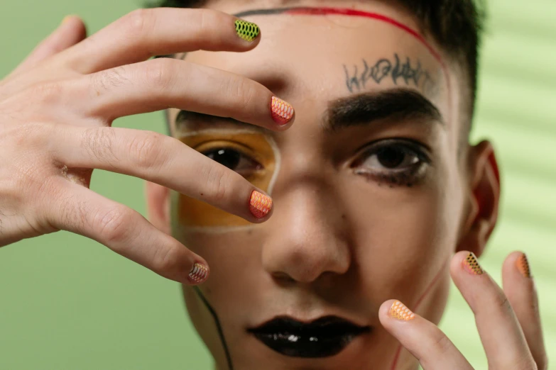 a close up of a person with a tattoo on their forehead, trending on pexels, hand painted textures on model, green skin with scales, teenage boy, nail art