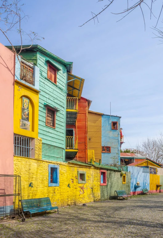 a street filled with lots of colorful buildings, buenos aires, wooden houses, 2022 photograph, square