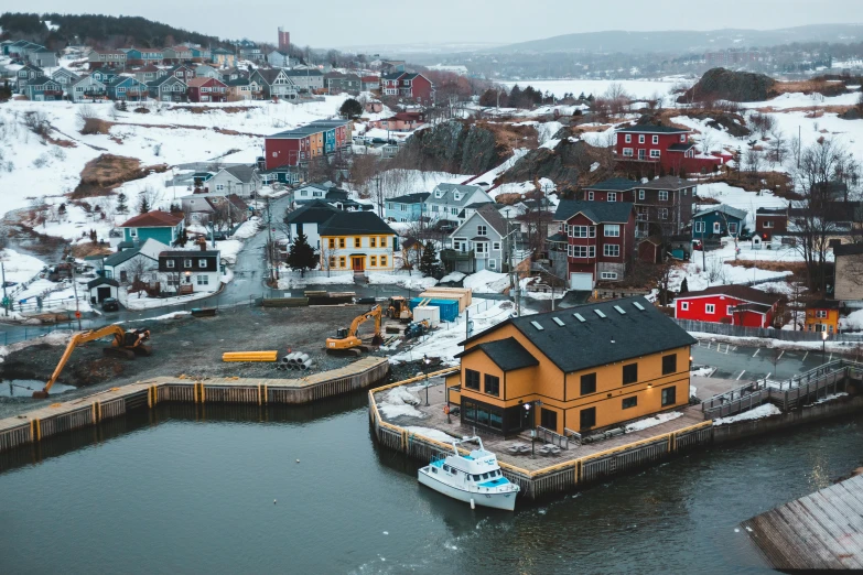 a large body of water next to a small town, by Brian Snøddy, pexels contest winner, shipyard, cold colours, 🦩🪐🐞👩🏻🦳, small port village