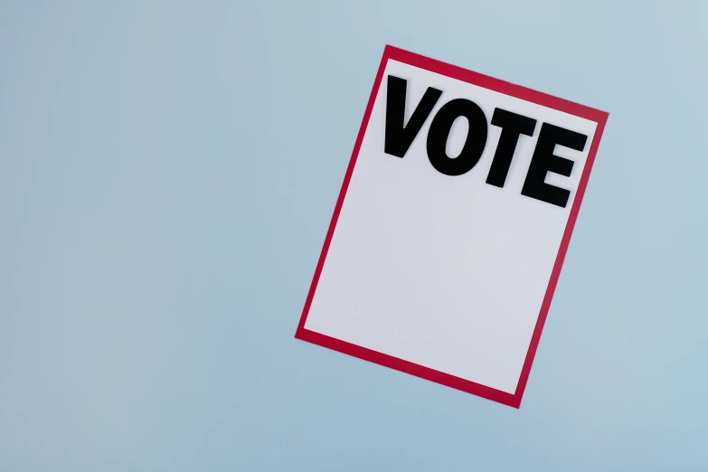 a piece of paper with the word vote on it, a poster, by Carey Morris, pexels contest winner, clemens ascher, poster template on canva, float, the