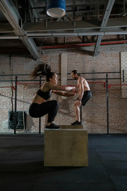 a man and a woman doing a trick on a box, athletic build, compression, thumbnail, ƒ/2.5