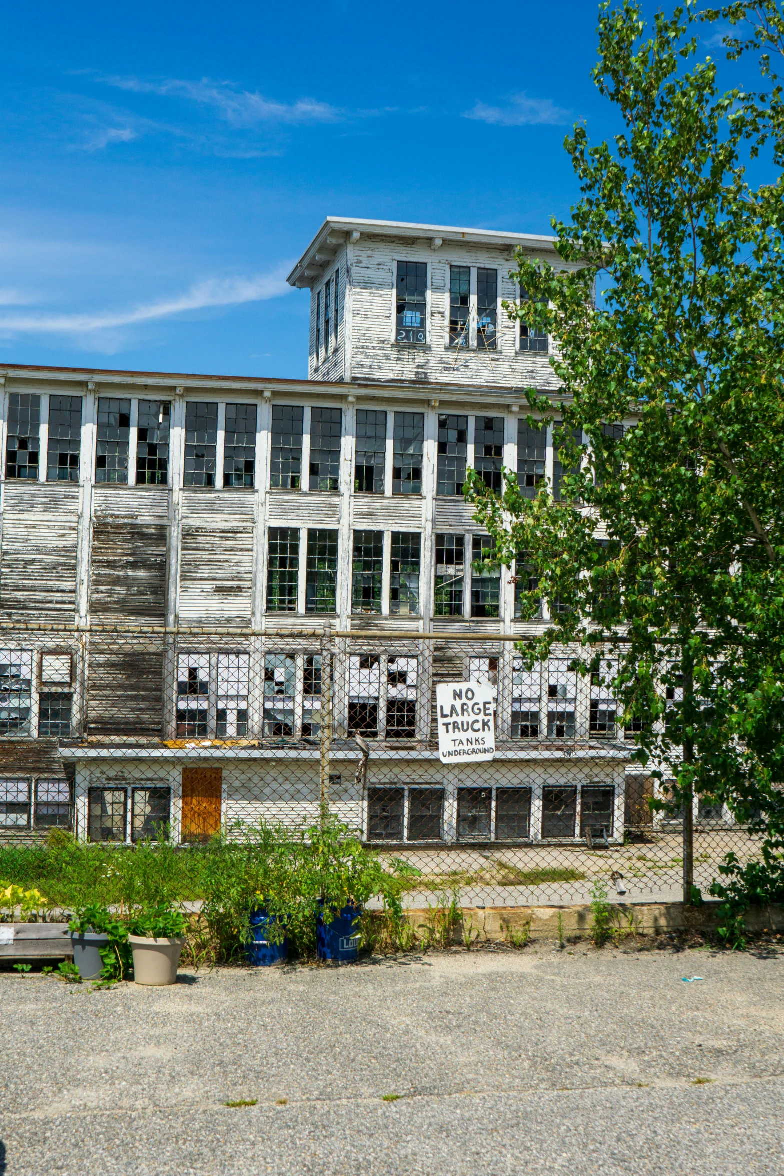 a red fire hydrant sitting in front of a building, inspired by Washington Allston, ashcan school, old lumber mill remains, slide show, white, ignant