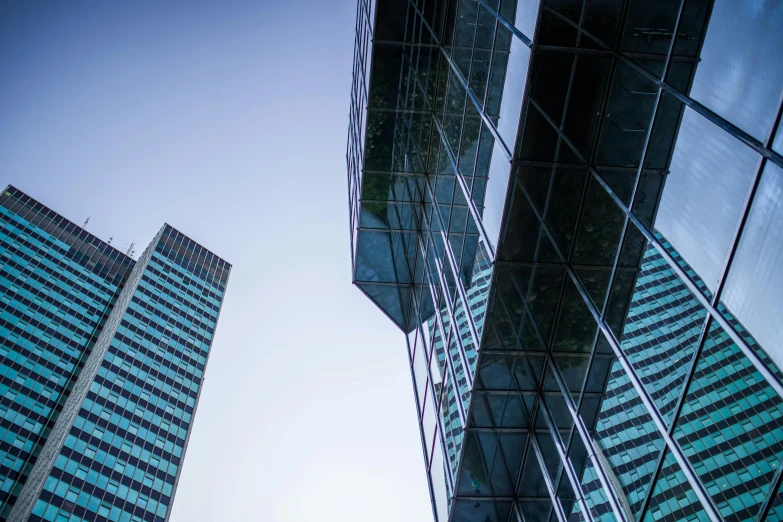 a couple of tall buildings next to each other, inspired by Richard Wilson, unsplash, aquamarine windows, corporate, three - quarter view, eyelevel perspective image