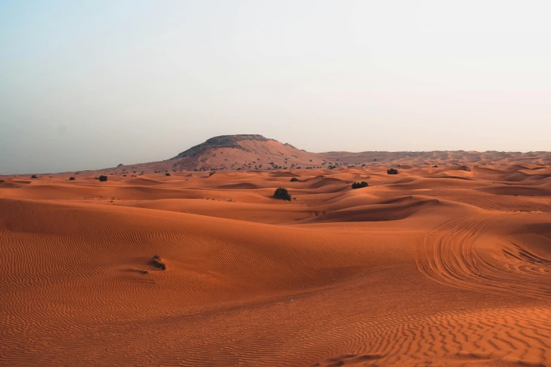 a desert with a hill in the distance, pexels contest winner, hurufiyya, lawrence of arabia, sandy colours, 🚿🗝📝