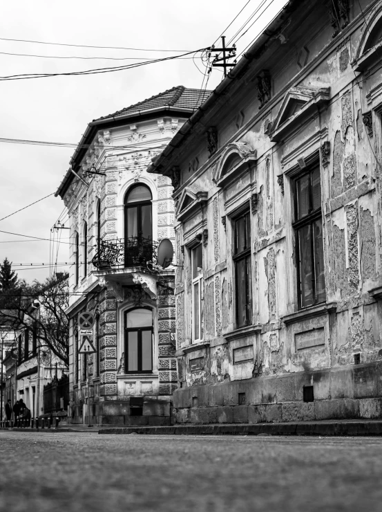 a black and white photo of an empty street, by Hristofor Žefarović, renaissance, house on background, an old abandoned mansion, dressed in ornate, greek romanian