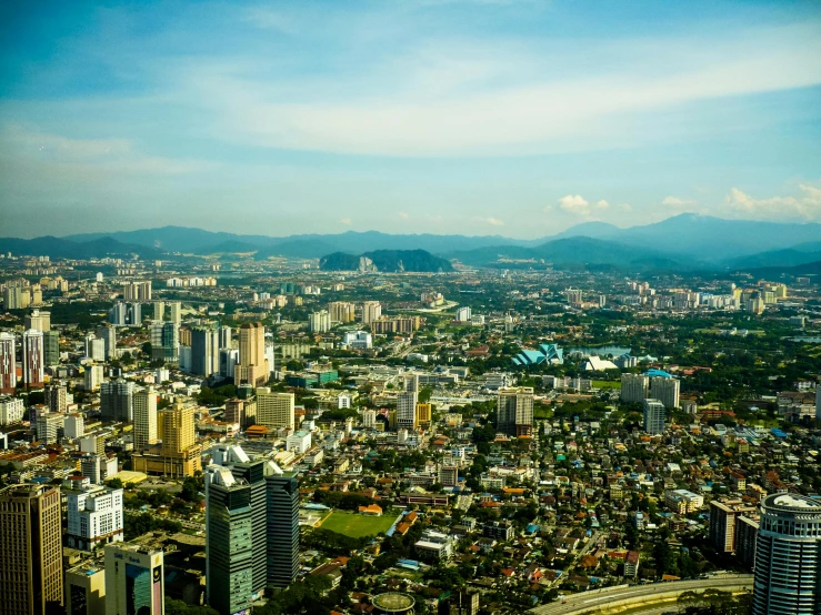 a view of a city from the top of a building, pexels contest winner, sumatraism, view from helicopter, high resolution print :1 cmyk :1, multiple stories, sunny day time