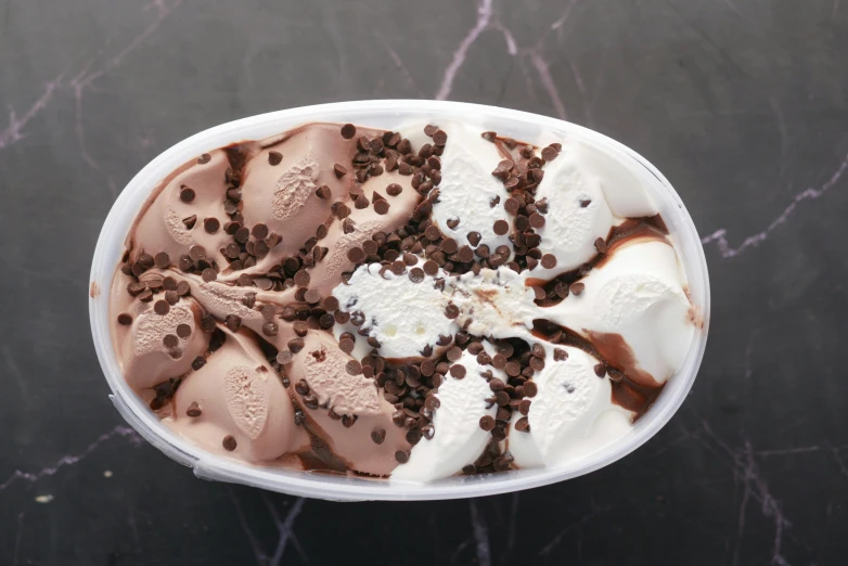 a bowl of ice cream topped with chocolate chips, detailed product image, chocolate river, all marble, beans