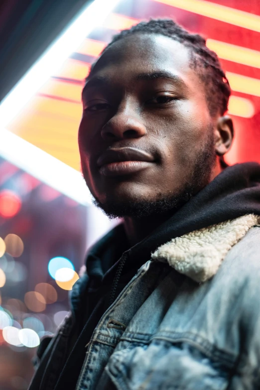 a man standing in front of a neon sign, an album cover, trending on pexels, renaissance, brown skin, cinematic headshot portrait, city lights, lil uzi vert