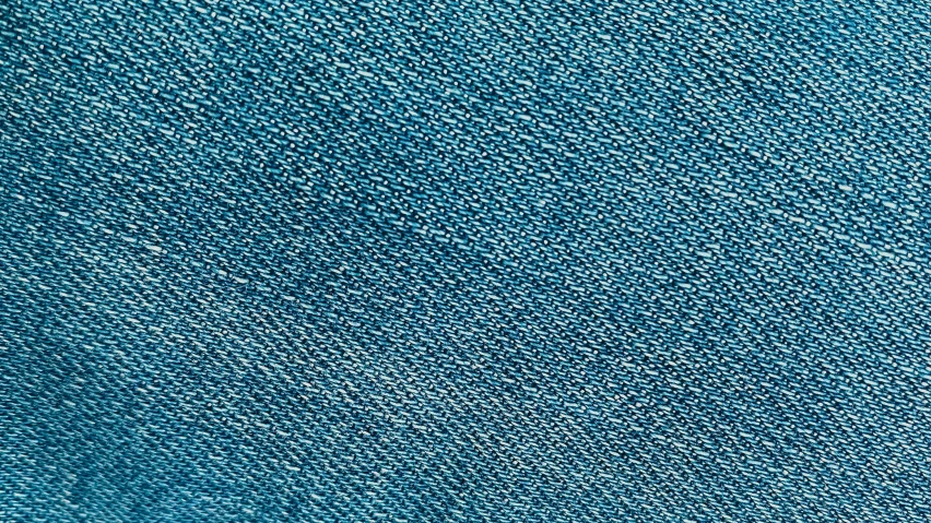 a close up of a blue cloth, a stipple, instagram, taken on iphone 14 pro, blue jeans. unreal 5, turquoise gradient, high details photo