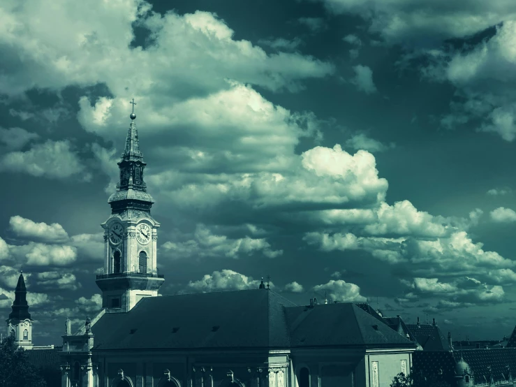 a black and white photo of a church with a clock tower, by Adam Marczyński, pexels contest winner, baroque, dramatic clouds cyan atmosphere, square, green smoggy sky, down-town