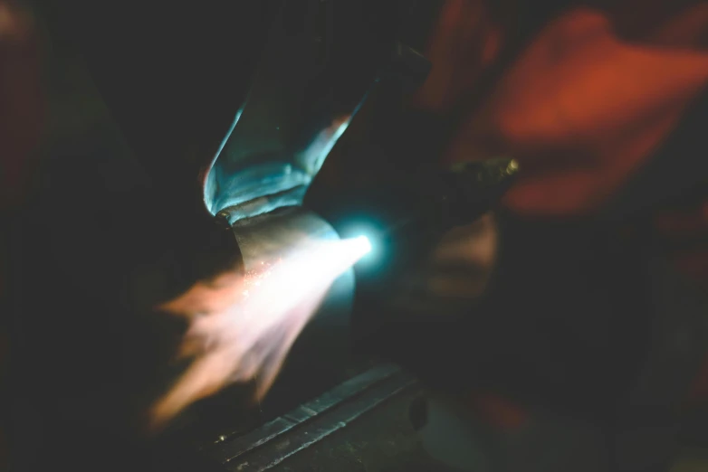 a person welding a piece of metal with a torch, an etching, by Thomas Häfner, pexels contest winner, flares anamorphic, worksafe. instagram photo, bio-mechanical bio-luminescence, high quality product image”