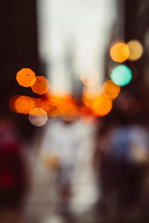 a blurry photo of a city street at night, by Niko Henrichon, trending on unsplash, macro bokeh ”, orange lights, day light, tiny points of light