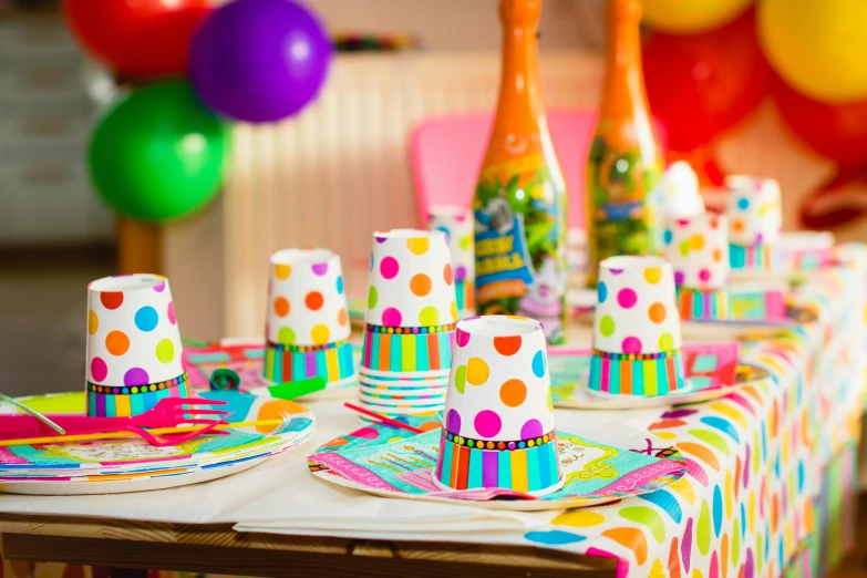 a table that has a bunch of plates and cups on it, by Julia Pishtar, shutterstock, party balloons, colorful ben day dots, papers on table, fancy dress