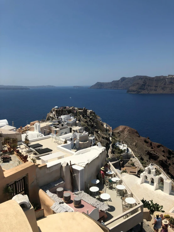 a view of the ocean from the top of a building, in santorini island, slide show