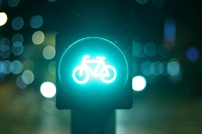 a traffic light with a bicycle sign on it, unsplash, glowing hue of teal, avatar image, wide greenways, paul barson