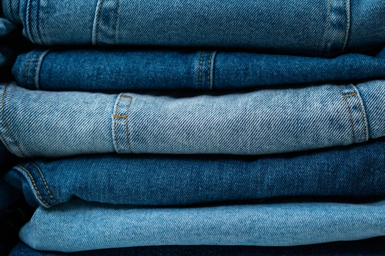 a stack of blue jeans stacked on top of each other, by Matija Jama, trending on unsplash, renaissance, warm azure tones, work clothes, soft blues and greens, thumbnail
