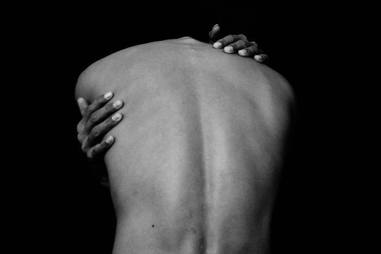 a black and white photo of a woman's back, by Jan Rustem, pain, by joseph binder, man is with black skin, 15081959 21121991 01012000 4k