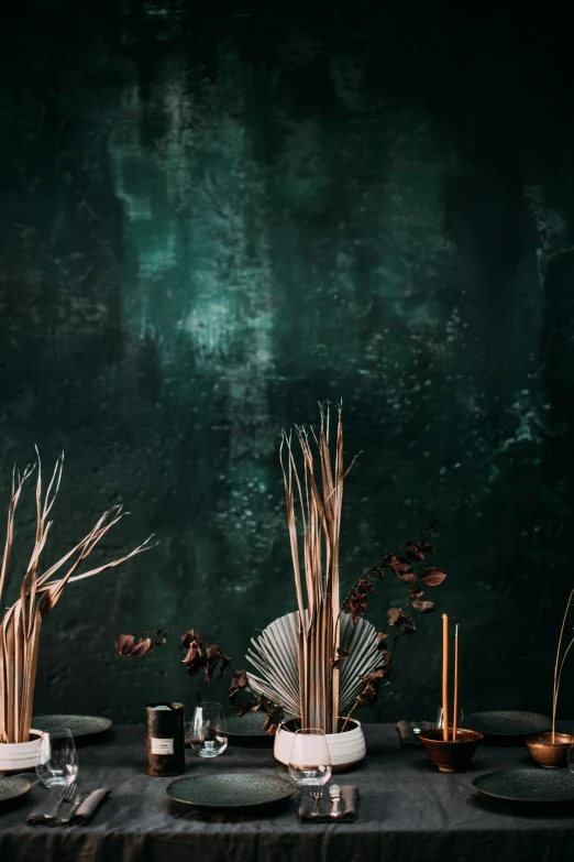 a table that has a bunch of plates on it, a still life, inspired by Jan Lievens, trending on unsplash, dark emerald mist colors, reeds, wall mural, rusted panels