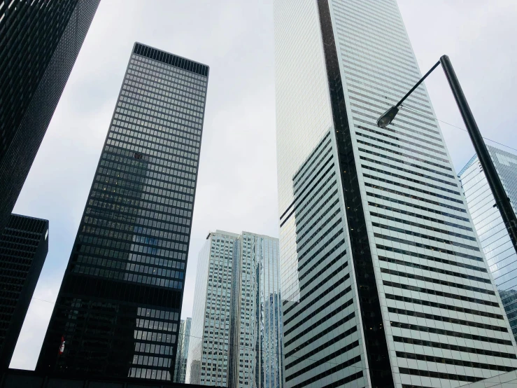 a group of tall buildings sitting next to each other, pexels contest winner, hypermodernism, toronto city, mies van der rohe, 2000s photo