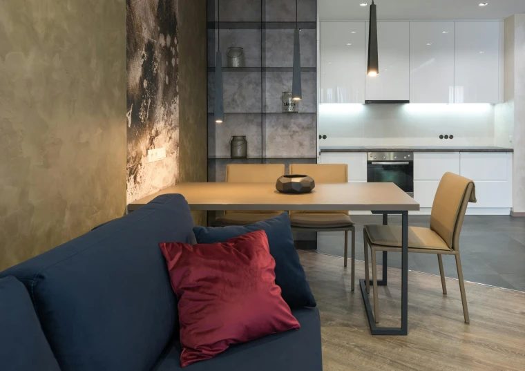 a living room filled with furniture and a wooden table, by Adam Marczyński, unsplash contest winner, altermodern, maroon and blue accents, concrete hitech interior, kitchenette and conferenceroom, neo kyiv