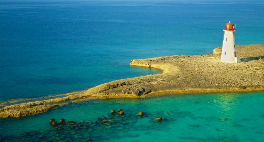 a lighthouse in the middle of a body of water, les nabis, archeological discover, sapphire waters below, islands on horizon, al - qadim