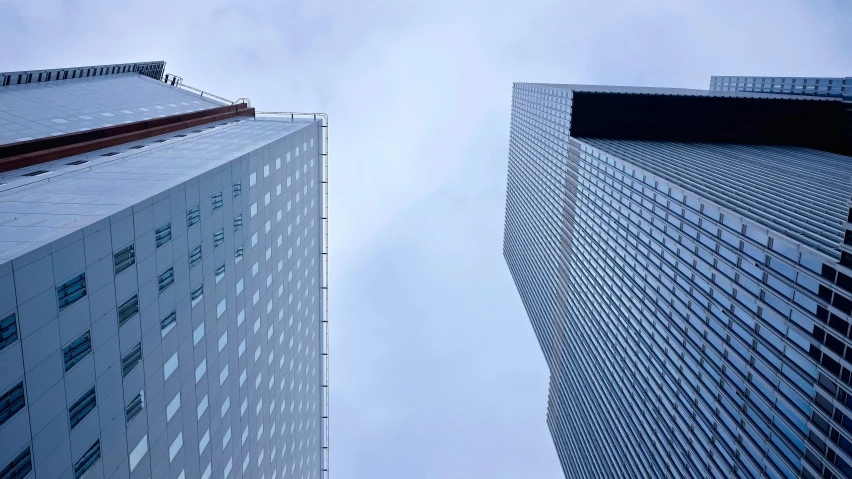 a couple of tall buildings next to each other, inspired by Richard Wilson, pexels contest winner, minimalism, moma, high vantage point, 2022 photograph, fan favorite