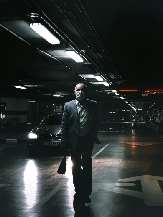 a man in a suit walking through a parking garage, by Pablo Rey, pexels contest winner, hyperrealism, elaborate lights. mask on face, bank robbery movies, standing in an arena, taken on iphone 14 pro