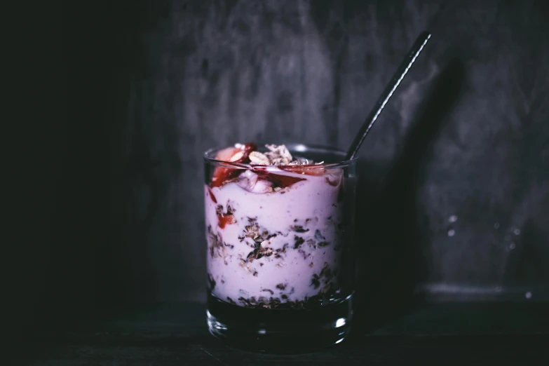 a close up of a drink in a glass with a spoon, a portrait, unsplash, yogurt, partially bloody crystallized, botanicals, background image