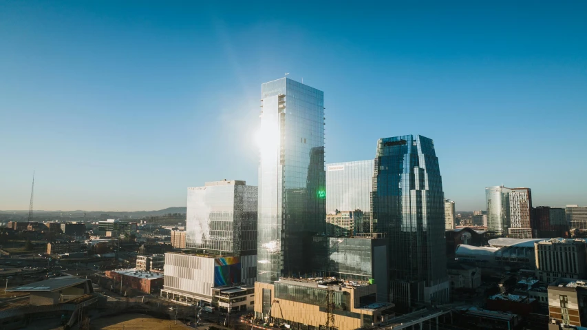 a large city with a lot of tall buildings, by Dan Frazier, unsplash contest winner, visual art, clear and sunny, capital plaza, morphosis, full morning sun