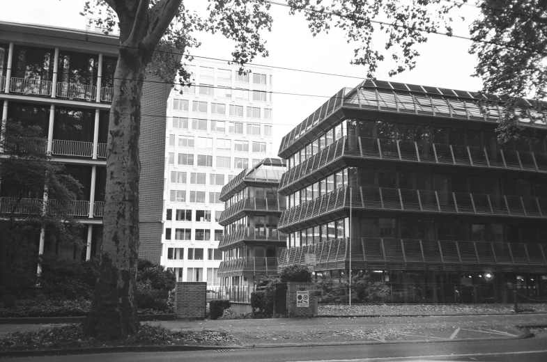a black and white photo of some buildings, by Egon von Vietinghoff, wim crouwel, 1 3 3 4 building, mid-transformation, transparent building