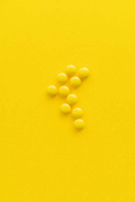 yellow pills on a yellow background, by Dietmar Damerau, unsplash, conceptual art, ffffound, formulas, beads, #oc