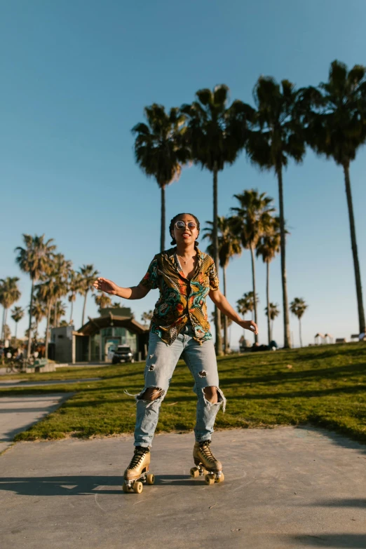 a woman riding a skateboard down a sidewalk, an album cover, trending on pexels, happening, palm trees on the beach, man standing in defensive pose, california;, stands in center with open arms