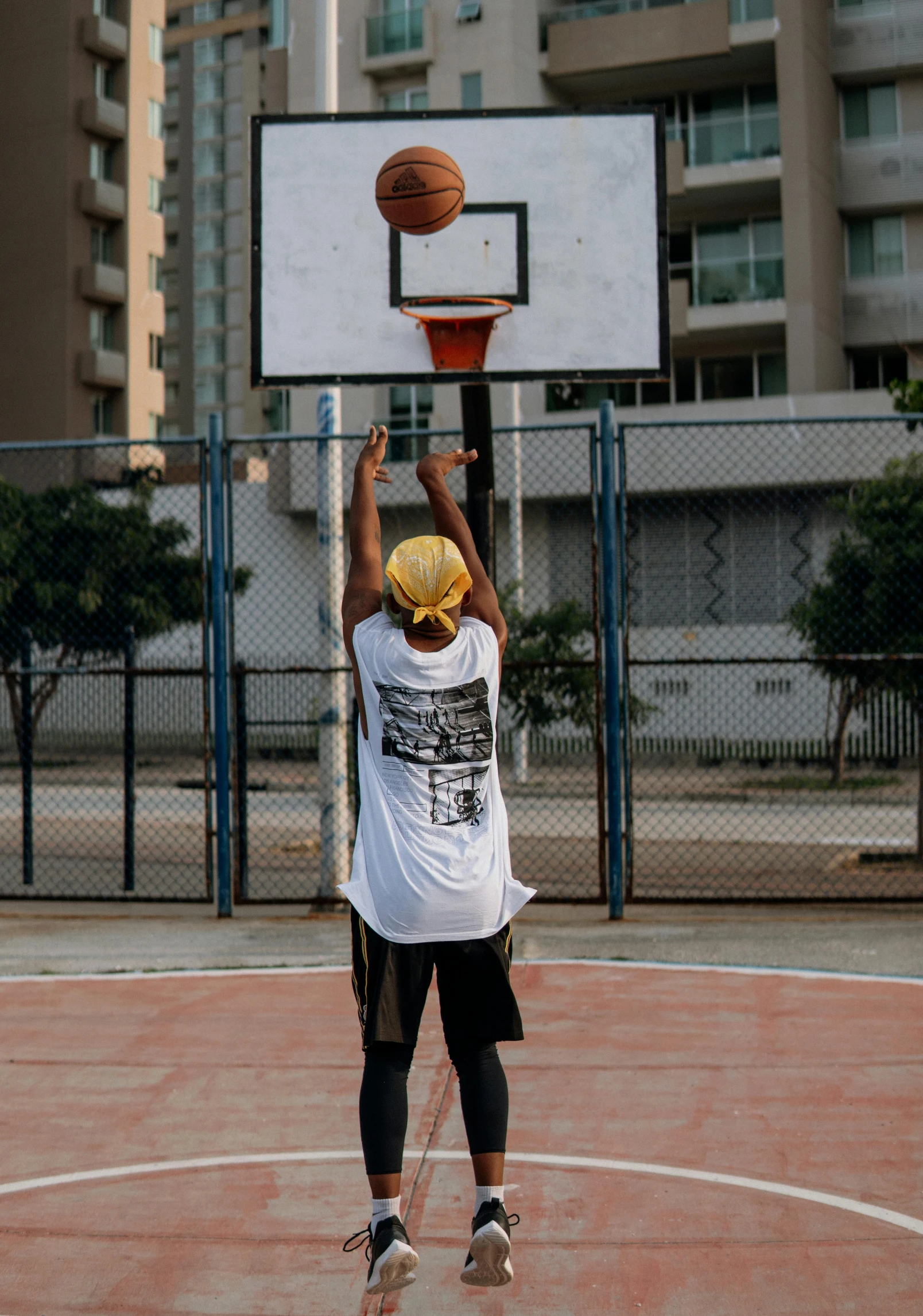 a man standing on top of a basketball court holding a basketball, by Matija Jama, trending on dribble, in sao paulo, mid action swing, 15081959 21121991 01012000 4k, instagram story