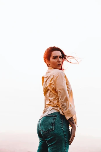 a woman standing on top of a lush green hillside, a picture, inspired by Elsa Bleda, trending on pexels, portrait androgynous girl, on white background, better known as amouranth, accentuated hips