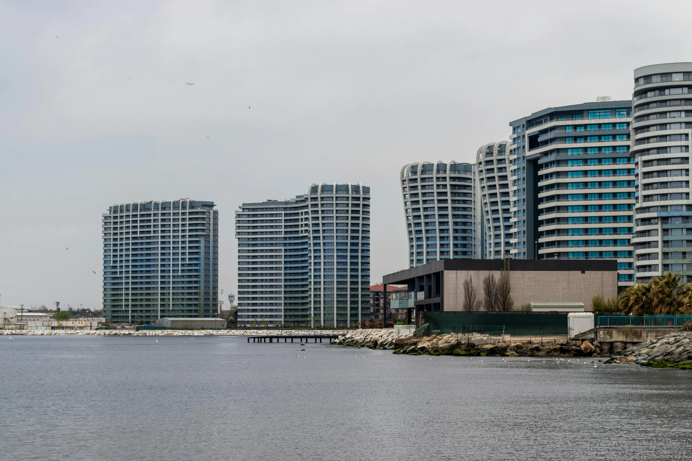 a large body of water surrounded by tall buildings, slide show, mixed development, thumbnail, istanbul