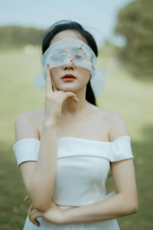 a woman in a white dress with a blind on her face, by Yu Zhiding, trending on pexels, aestheticism, floral dream, skincare, wearing an eyepatch, translucent body