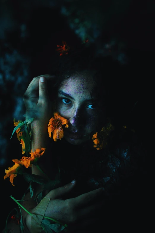 a woman holding flowers in front of her face, by Adam Marczyński, pexels contest winner, glowing in the dark, made of flowers and leaves, blue and orange tones, portrait of a ominous girl