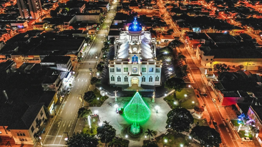 an aerial view of a city at night, a photo, by Luis Miranda, pexels contest winner, shipibo, christmas, town hall, thumbnail