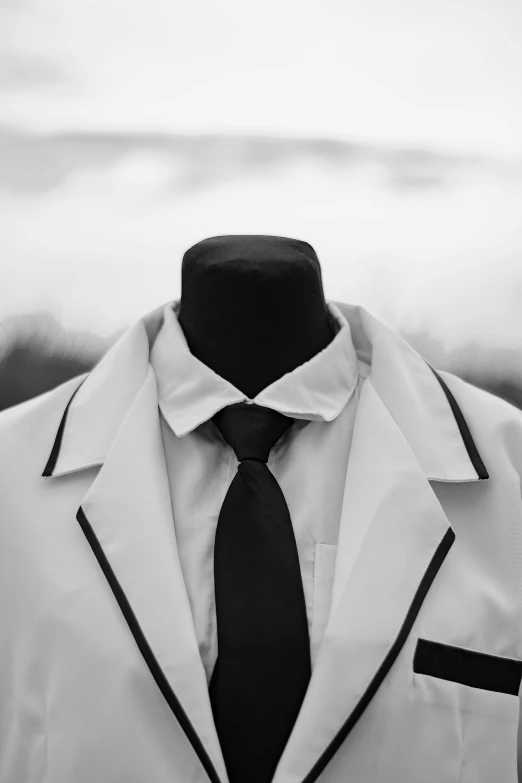 a mannequin dressed in a suit and tie, an album cover, unsplash, lab coat, mourning, uniform, neckline