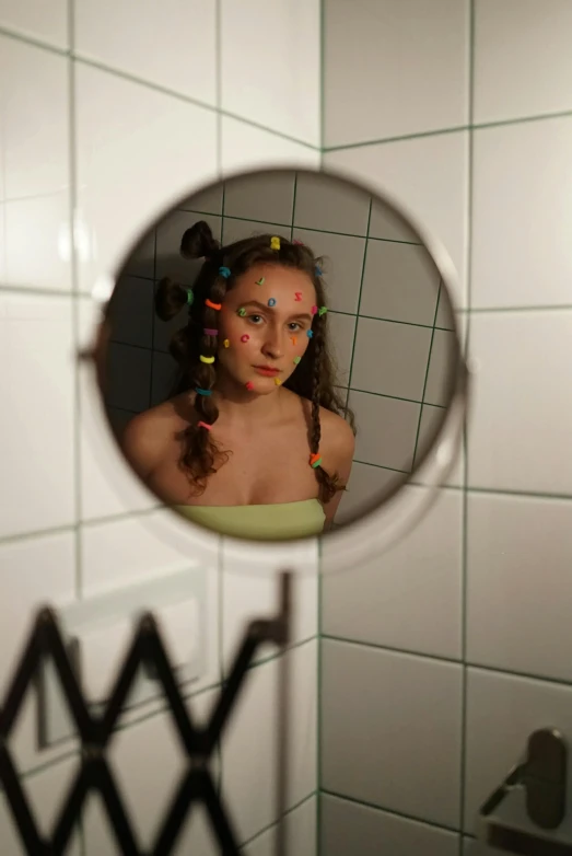 a woman that is standing in front of a mirror, an album cover, flickr, portholes, girl with plaits, in bathroom, coloured photo