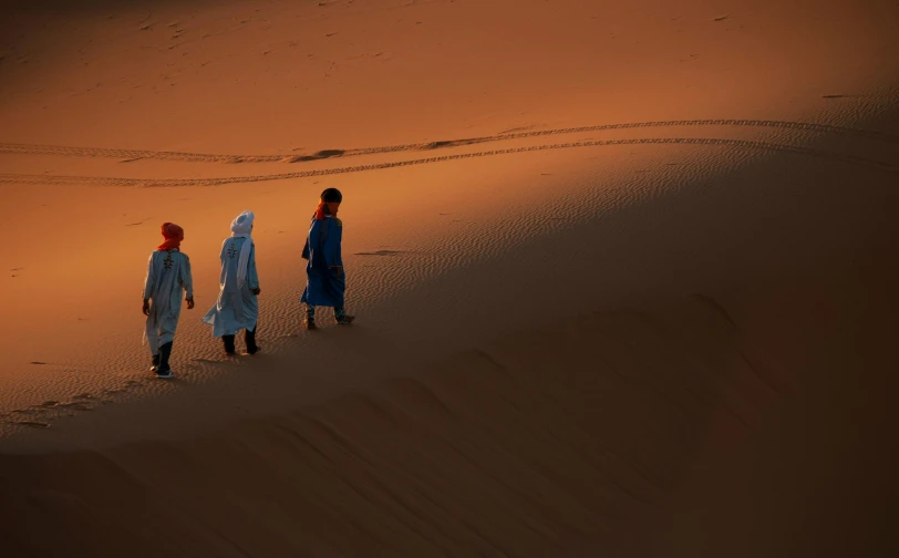 a couple of people that are walking in the sand, les nabis, the three moiras, close to night, national geography photography, high res 8k