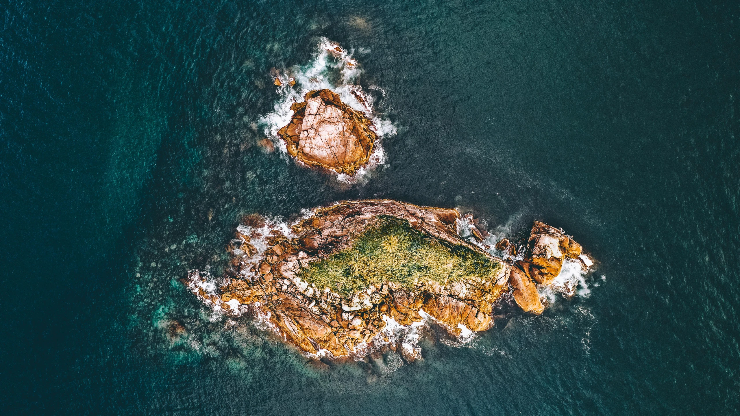 two rocks in the middle of a body of water, by Lee Loughridge, pexels contest winner, aerial photo, straya, icon, profile pic